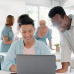 A Guide to Affordable Online Course Solutions fist bump success and people on laptop in office t lbkezr6