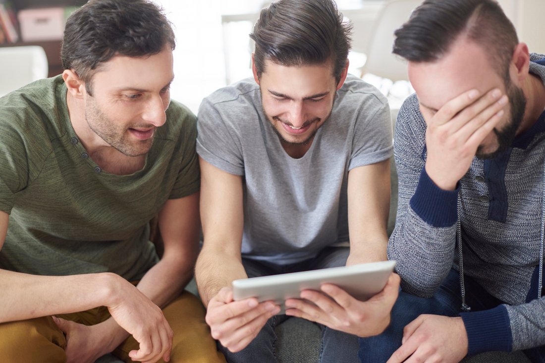friends browsing photos from their old times pvn2fnw.jpg