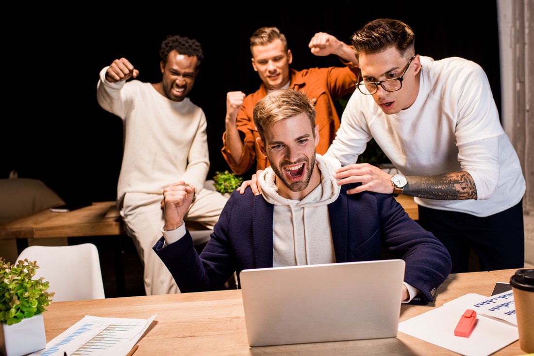 happy multicultural businesspeople showing winner rujhp8n.jpg